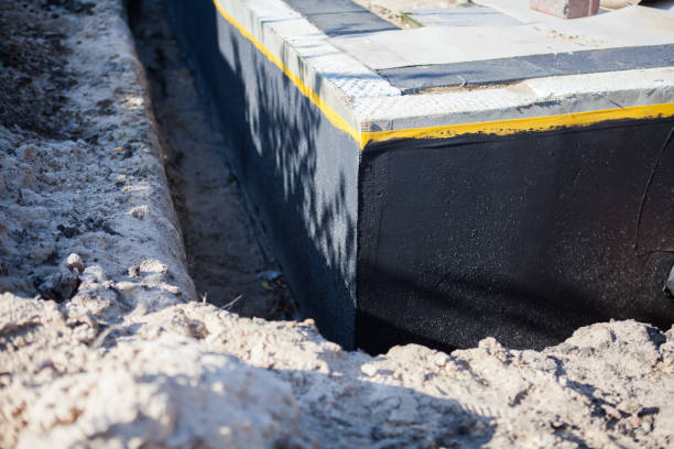 Professional Waterproofing technician working in Windsor, VA